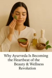 A South Asian woman in a beige outfit applies a green Ayurvedic face mask while smiling softly. She is surrounded by Ayurvedic wellness items like herbal oil, a compress, and dried herbs, placed on a natural-toned surface. The scene visually represents the theme: Why Ayurveda Is Becoming the Heartbeat of the Beauty & Wellness Revolution.